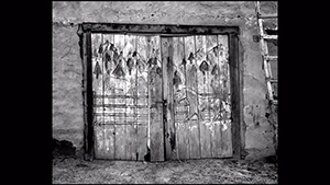 A black and white picture of a door.