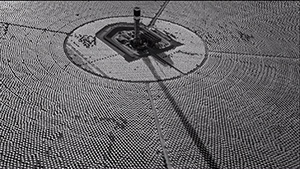 A black and white photo of a clock tower.