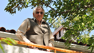 A man standing on a railing.