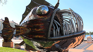 A metal sculpture of a fish.