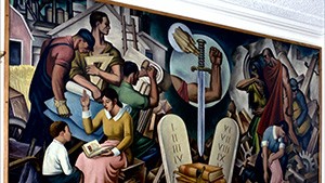 A mural depicting a group of people in a room.
