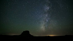 The milky in the night sky over a desert.