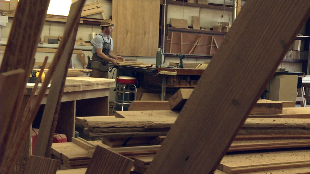 A man working in a wood shop.
