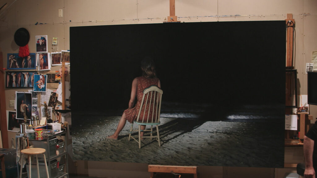 A painting of a person sitting in a chair in front of darkness