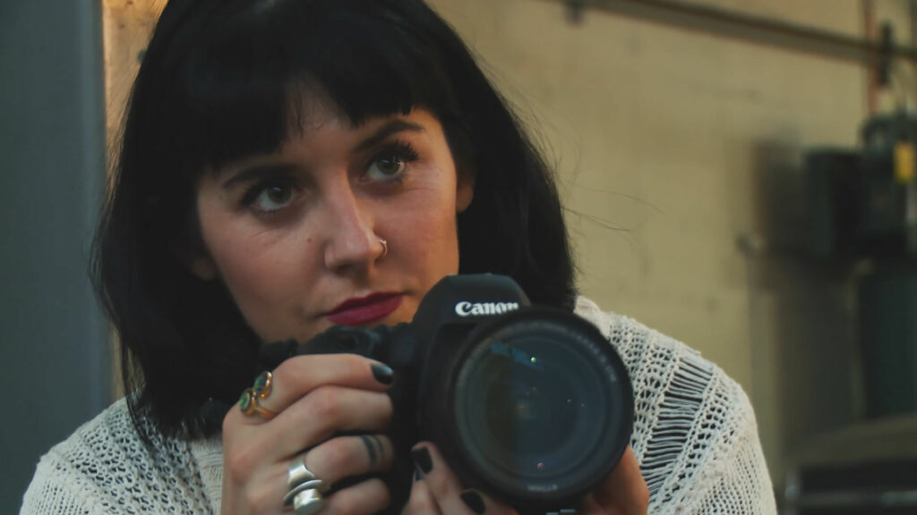 A photographer holding a camera