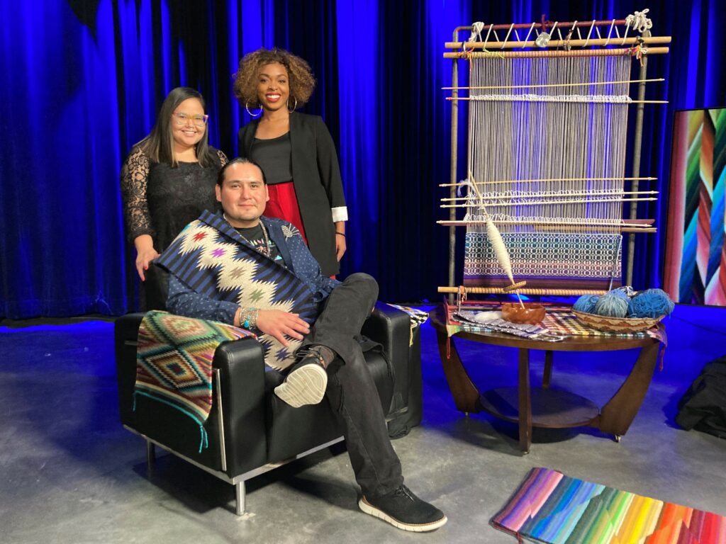 Navajo Weaver Venancio Aragon with Maliaq Kairaiuak and ¡COLORES! Host Ebony Isis Booth.