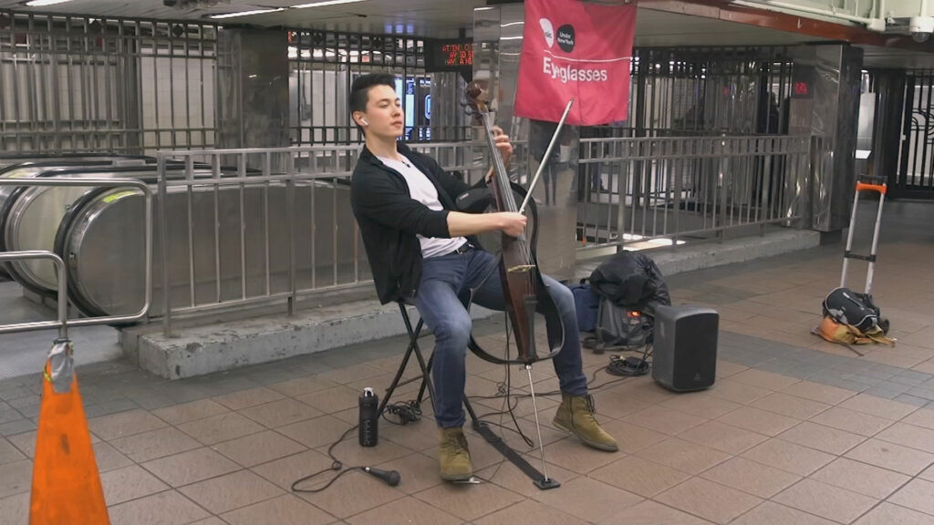 Iain Forrest performing the cello in a New York Subway.