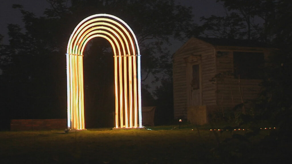 A golden light arch in the dark.
