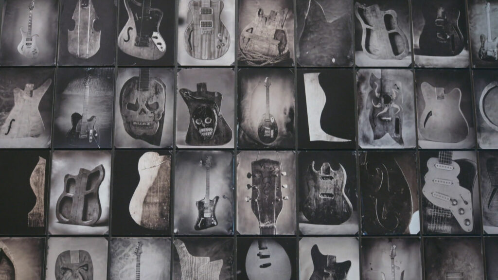 A collage of black and white images of art pieces related to guitars.