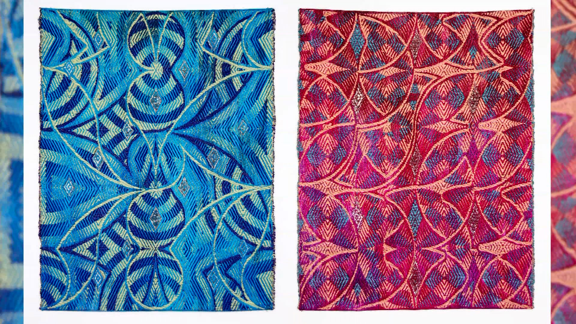 Two intricately patterned textiles hang side by side; the left one is blue with geometric designs, and the right one is red with similar geometric patterns.