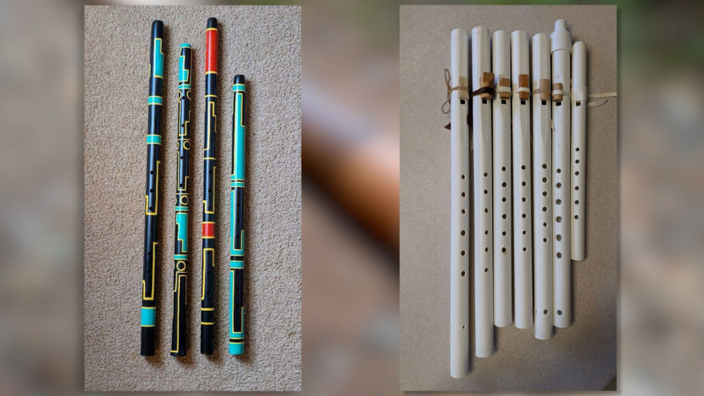 Four painted wooden flutes with geometric patterns are on the left, and seven plain white flutes of varying lengths are on the right, displayed on a flat surface.