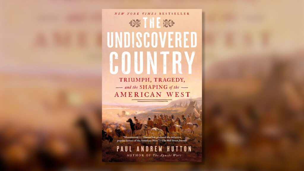 Book cover for "The Undiscovered Country" by Paul Andrew Hutton, showing a painting of pioneers and horses traveling across the American West.