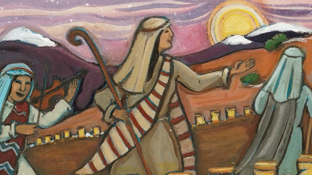Three people in traditional Middle Eastern attire walk outdoors at sunset, one holding a staff, with mountains and the sun in the background.