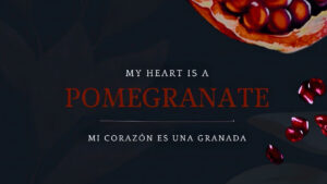 A sliced pomegranate and scattered seeds on a dark background, with the text "My heart is a pomegranate" and its Spanish translation below.