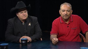 Two men sitting at a table.