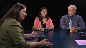 A group of people sitting at a table.