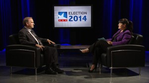 A man and woman sitting in chairs.