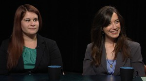 Two women sitting at a table.