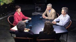 A group of people sitting around a table.