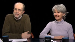 A man and woman sitting at a table.