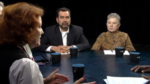 A group of people sitting around a table.