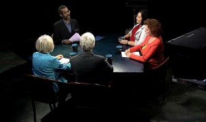 A group of people sitting around a table.