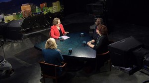 A group of people sitting around a table.