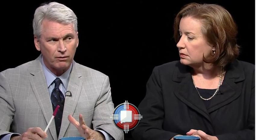 A man and woman talking on a television show.