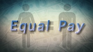 The word equal pay on a background of money.