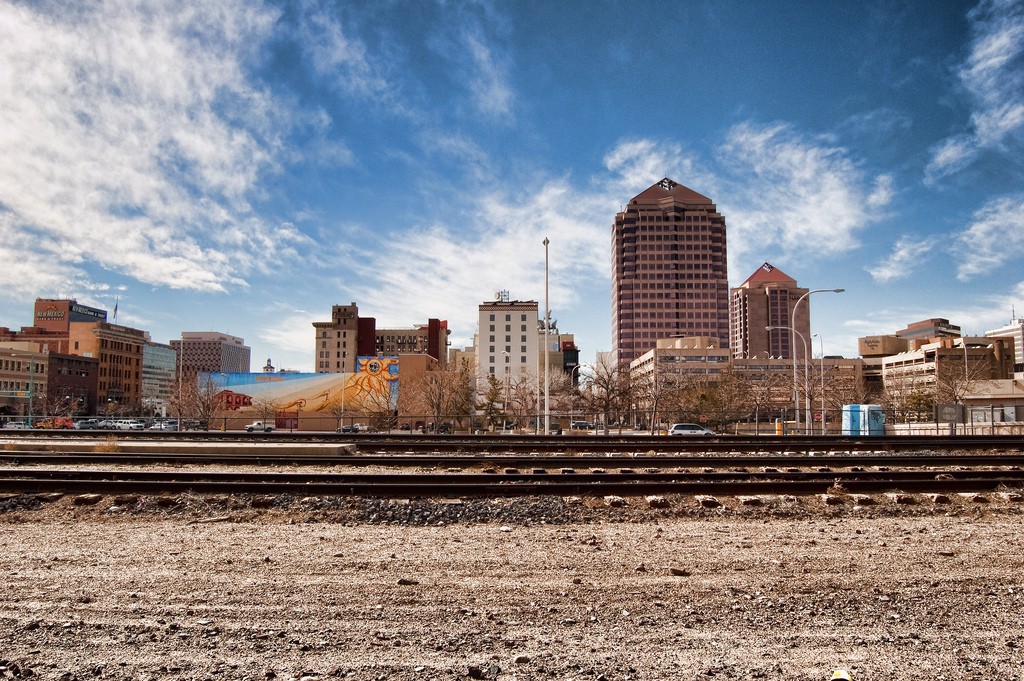 A city skyline in the distance.