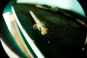 A syringe sitting on a table.