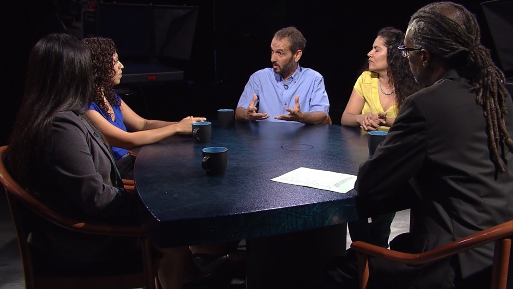 A group of people sitting around a table.