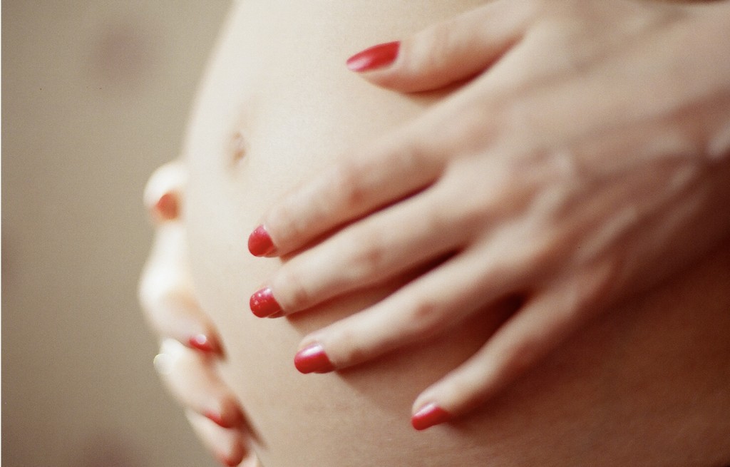 Close up of a pregnant woman's belly.