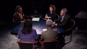 A group of people sitting around a table.