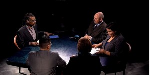 A group of people sitting around a table.