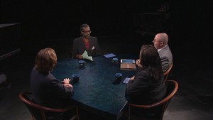 A group of people sitting around a table.