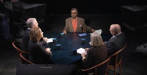 A group of people sitting around a table.