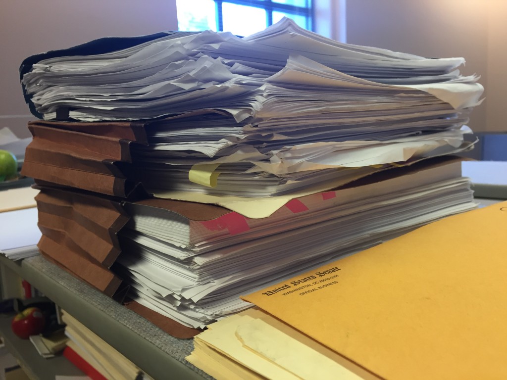 A stack of papers on a table.
