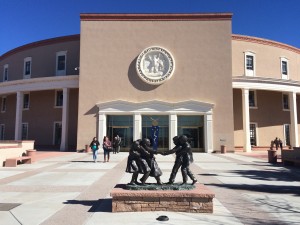 A statue of children in front of a building.