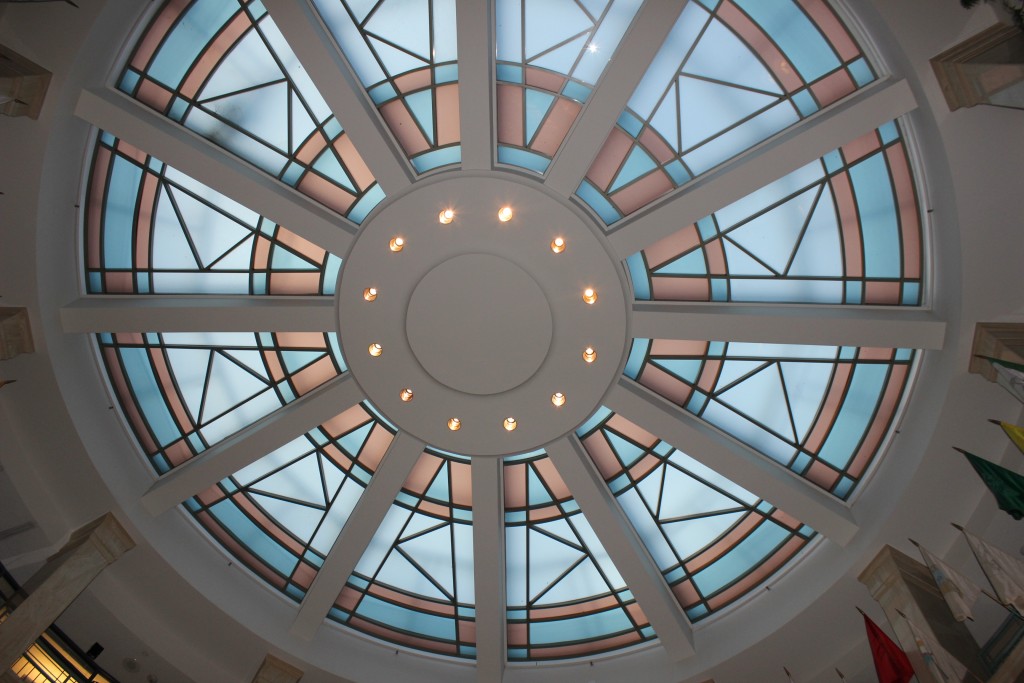 A circular window in the ceiling of a building.