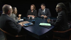 A group of people sitting around a table.