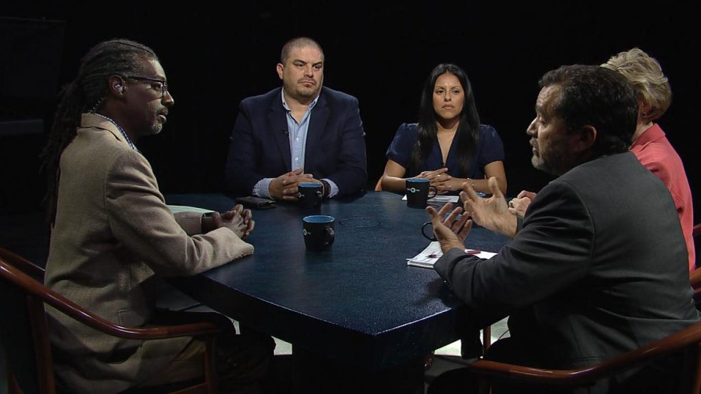 A group of people sitting around a table.