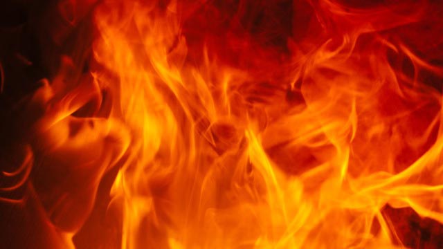 A close up of a fire on a black background.