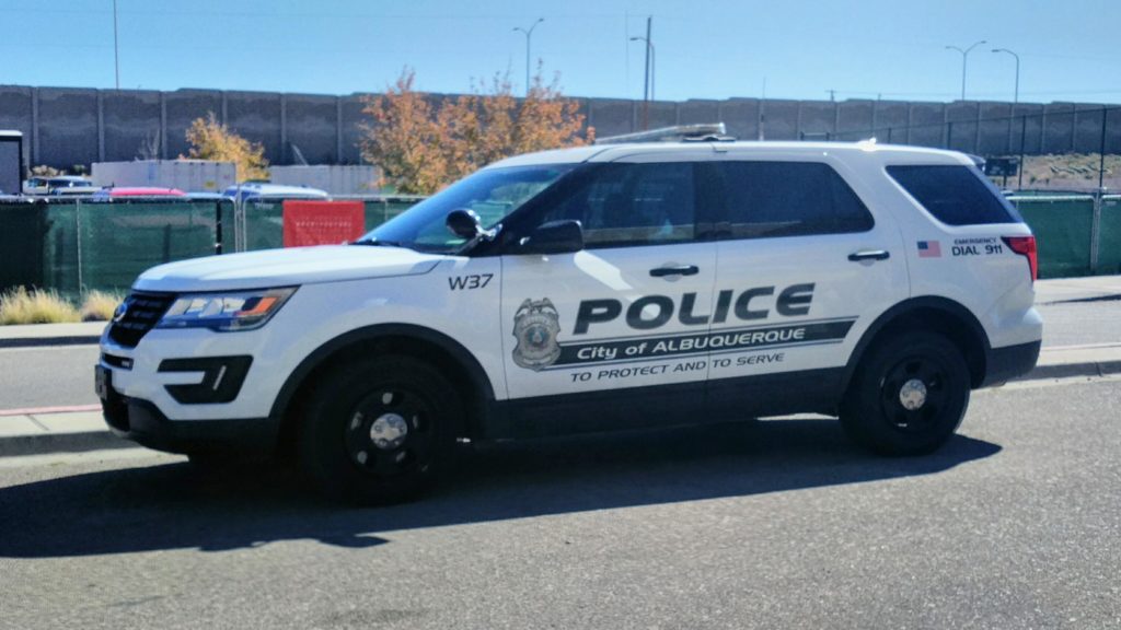 A police car parked on the side of the road.