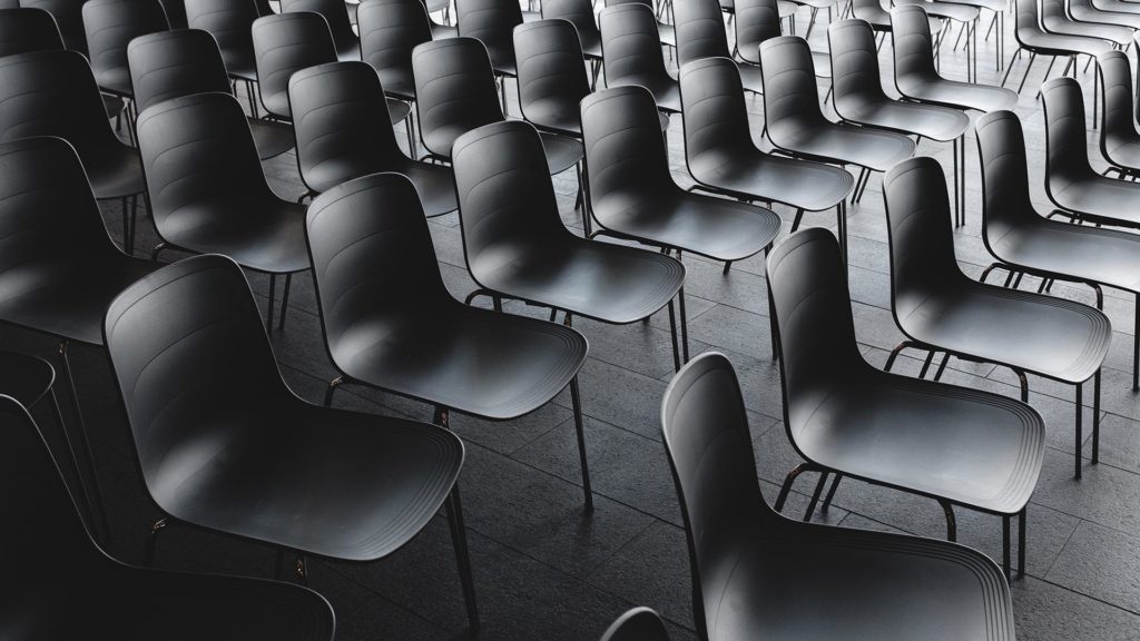 An array of sleek, empty chairs.