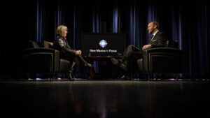 Michelle Lujan Grisham and Matt Grubs discuss with each other in the NMIF studio.