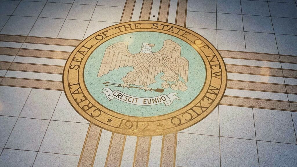 The seal of New Mexico, printed onto a tile floor.