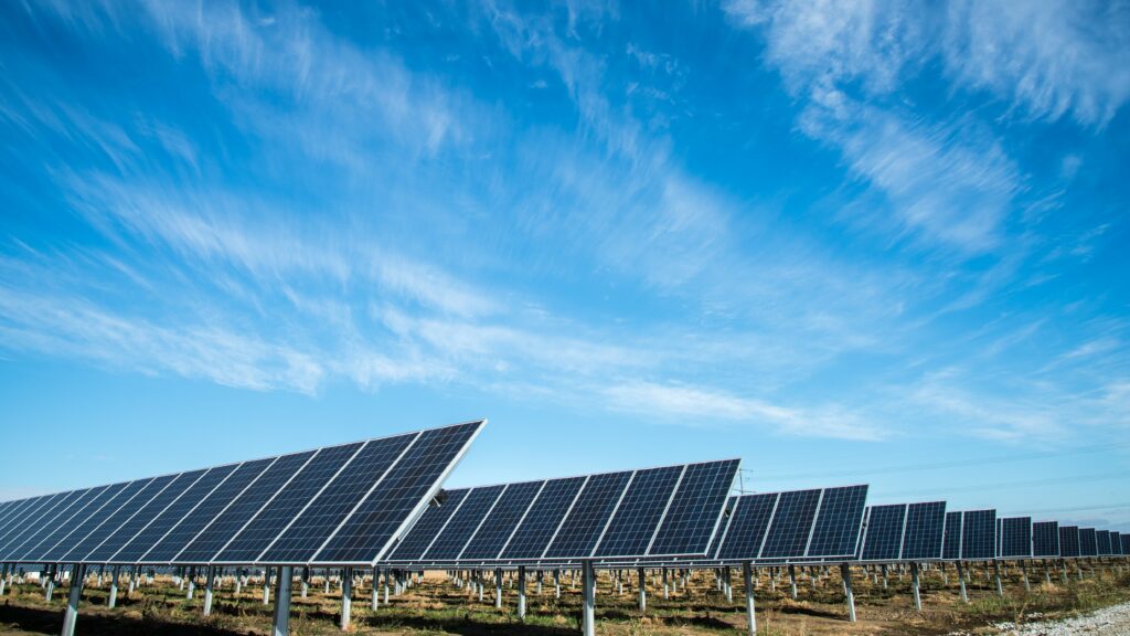 An array of solar panels in the desert.