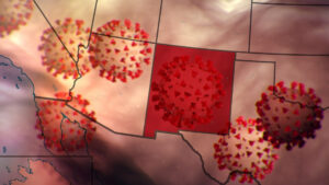 Composite of U.S. map with New Mexico highlighted, with coronaviruses flowing behind it.