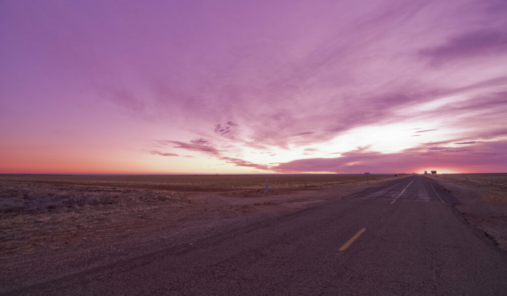 A purple sunset viewed with a very far vanishing point.